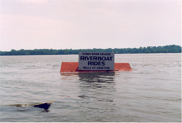 Photo of the Riverboat Rides Sign under water?—Many businesses were closed during the flood.